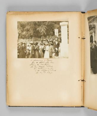 A procession of pilgrims from the Stations of the Cross showing the beautiful Ste. Anne Banner, which was destroyed by fire in the Temporary Church, Ste. Anne de Beaupré. Page 38 of Ste Anne de Beaupré; from collection of Canadian albums compiled by Edith S. Watson, 1890s-1930s