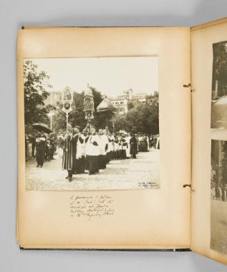 A procession of pilgrims in the Park, with the beautiful old Basilica Emblems, destroyed by fire in the temporary church. Page 14 of Ste Anne de Beaupré; from collection of Canadian albums compiled by Edith S. Watson, 1890s-1930s