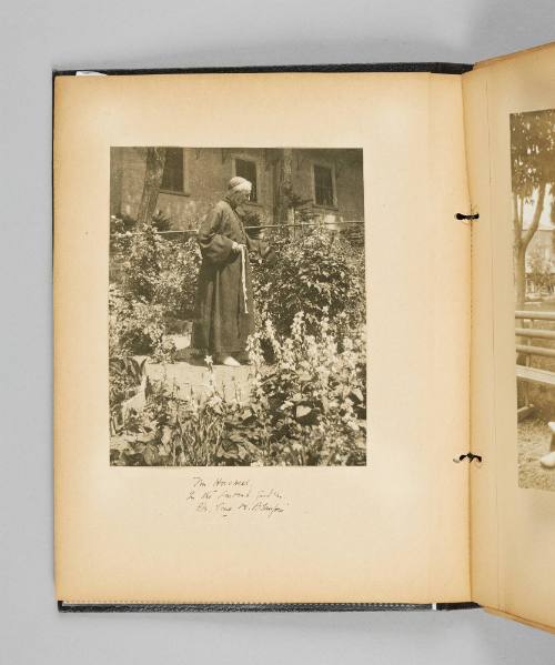Mr. Hoswell in the convent garden. Ste. Anne de Beaupré. Page 4 of Ste Anne de Beaupré; from collection of Canadian albums compiled by Edith S. Watson, 1890s-1930s