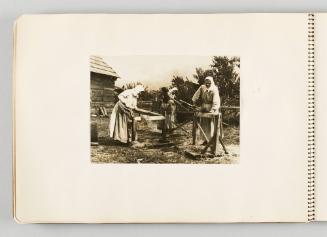 [Three smiling women cutting crops in yard, page 32 of The Doukhobors I album