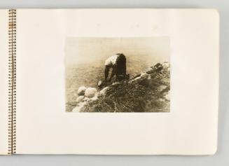 [Woman gathering sticks from water, page 27 of The Doukhobors I album]