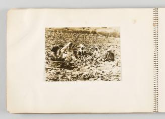[Women and children sitting in a semicircle on farmland, page 22 of The Doukhobors I album]