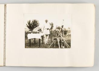 [Man with gardening tools and fresh produce on table, page 3 of The Doukhobors I album]