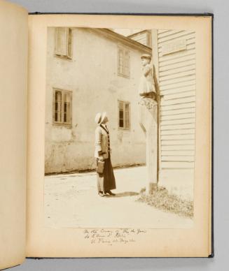 On the corner of "Rue du Quai de L'Amee d'Helia", St. Pierre et Miquelon [Page 29 of Happy Voyages with Queenie album]