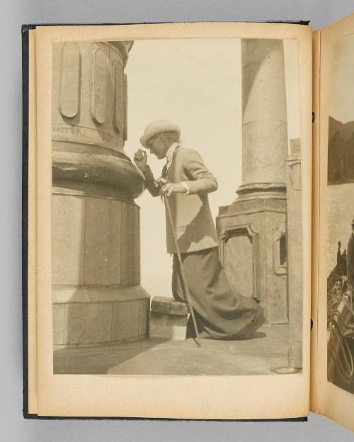 [Image of Queenie kneeling on a wooden stool at the foot of a grand column], page 8 of Happy Voyages with Queenie album]