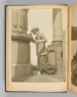[Image of Queenie kneeling on a wooden stool at the foot of a grand column], page 8 of Happy Voyages with Queenie album]