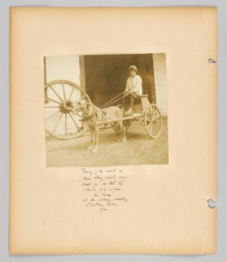 Many of the seats in these tiny carts are built up so that the driver sits above his "horse" at the village Smithy Chateau Richer, Que. [Page 60 of Children album]
