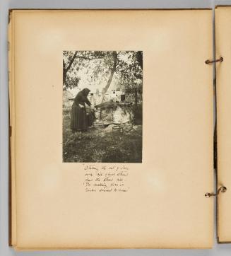 Stoking the out-of-door oven with wheat straw from the straw pile for making pies in Tauks second to none [Page 46 of Wells and Pots album]
