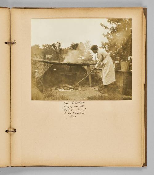 Habitant family has its big oven pot, in Que. [Page 33 of Wells and Pots album]
