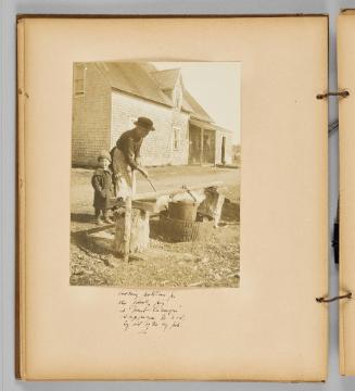 Cooking potatoes for the family pig at Haute Lamique, Shippegan Is. N.S. by aid of the big pan [Page 26 of Wells and Pots album]
