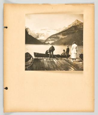 [Folks coming and going at a canoe dock, Lake Louise] [Page 19 of Banff, Lake Louise album]
