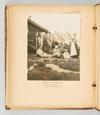 Drying and picking over flax, for spinning, Grand Forks, B.C. [Page 78 of The Doukhobors II album]
