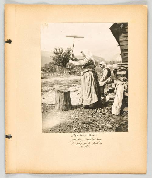Doukhobor woman pounding mustard seed in home made wooden mortar [Page 59 of The Doukhobors II album]
