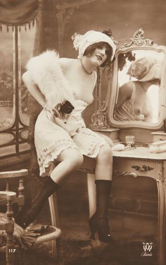 [Woman seated on boudoir table]