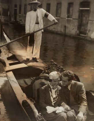 Honeymoon in Venice. The young couple enjoy a quiet ride through the waterways of Venice.