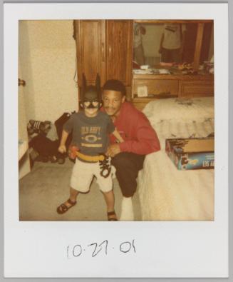 10.27.01 [Little boy with batman mask on posing with man]