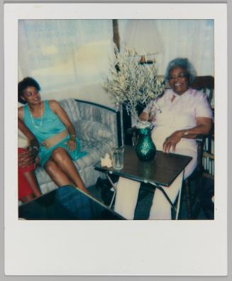 Levonia Brown 81st Birthday, July 4, 1986 [Woman in blue on couch with elderly woman in chair with plant]