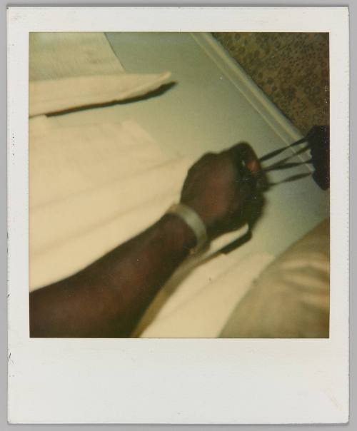 [Hand holding a bag]
