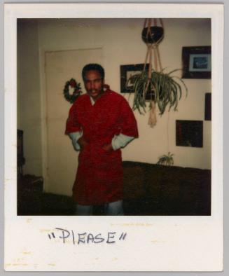 "Please" [Man in red robe standing in front of Christmas wreath]
