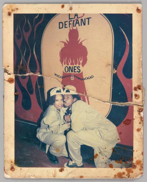 [Man and woman in matching outfits, L.A. Defiant Ones]
