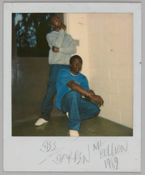 [DSS?] Darren [illeg.] Bullion 1989 [Two men posing outside, man in front is kneeling in a blue t-shirt, man behind is standing in grey sweatshirt]