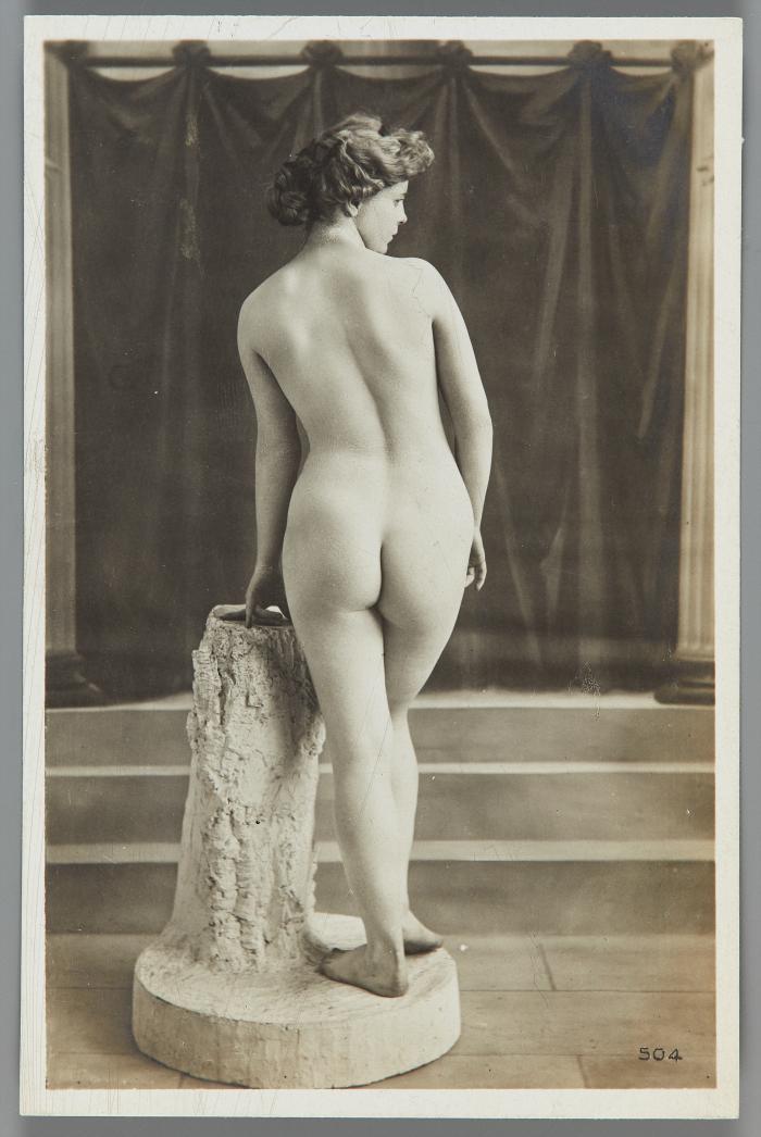 [Woman posed on plaster stand, back view]
