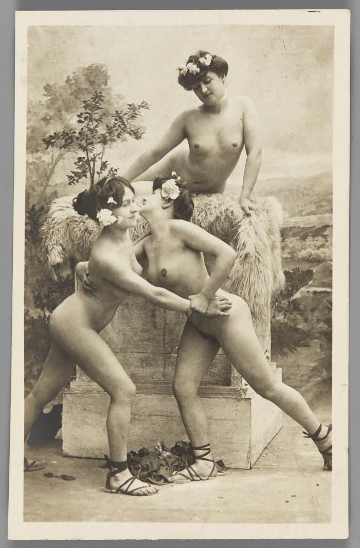 [Three women with flowers in hair, seashore setting]