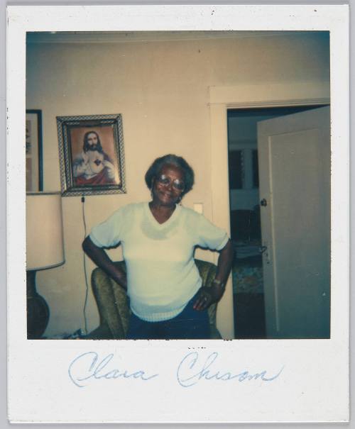 Clara Chisom [Elderly woman posing with her hands on her hips]