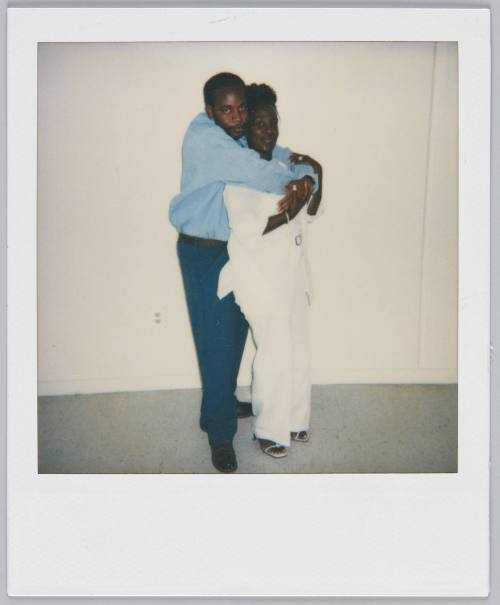 Clo [illeg.] 6-10-00 [illeg.] [Young couple posing, man standing behind woman with his arms wraped around her]