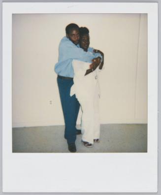 Clo [illeg.] 6-10-00 [illeg.] [Young couple posing, man standing behind woman with his arms wraped around her]