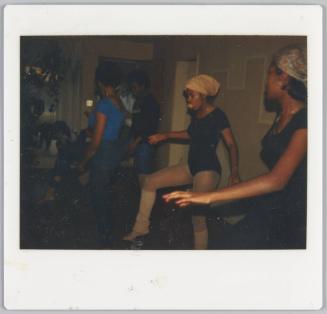 [Women dancing, woman in centre wearing a leotard and tights]
