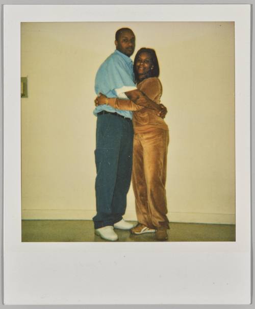 Ant + Michelle 3.9.03 [Woman in velour tracksuit hugging man in blue short-sleeved shirt]