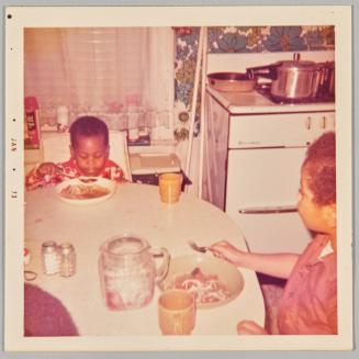 Little Franklin is eating his food
