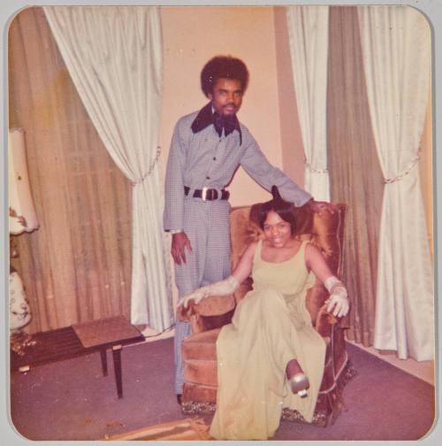 To Gloria My favourite cousin Love Michael Smith -n- Cheryl Jones Sweetheart Ball “Picture of the night” As well as the year 2/23/74 [Couple posing, woman wearing green gown sitting in chair]
