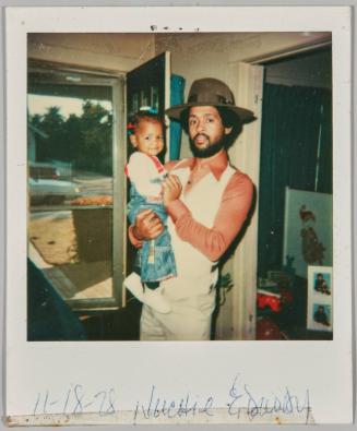 Nuchie & Daddy, 11-18-78 [Father wearing brown hat holding little girl]