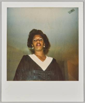 [Woman wearing black and white with dark lip liner]
