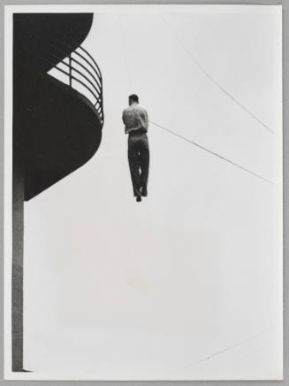 A new rescue procedure: escape from buring rooms on a wire.