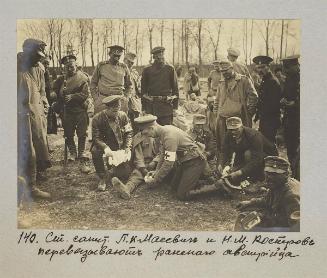 Senior mеdic P.K Masevich and N.M Kostrov bandaging wounded austrian.