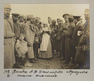 Paramedic A.F Ipolitova dirtributes letters for captives