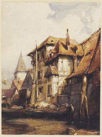 Vieilles maisons et clocher au bord d'une rivière