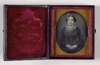 [Portrait of a young woman with folded hands]