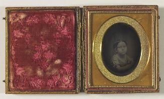 [Portrait of a young child in a scooped neckline dress]