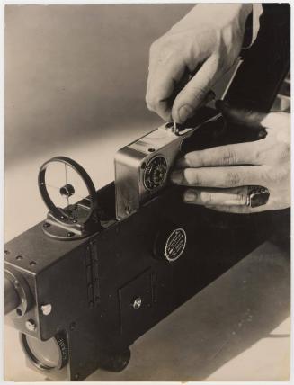 The Camera Shoots. The Camera Mechanism with the Film Chamber is following the same Procedure used in the Machine Gun, as in the Ernst-Falle Munitions.
