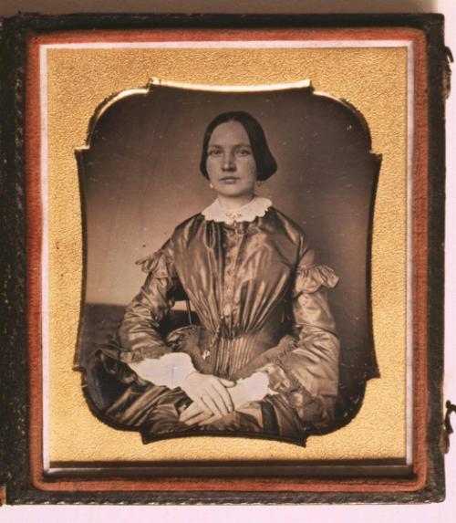 [Young Woman in Satin Dress]