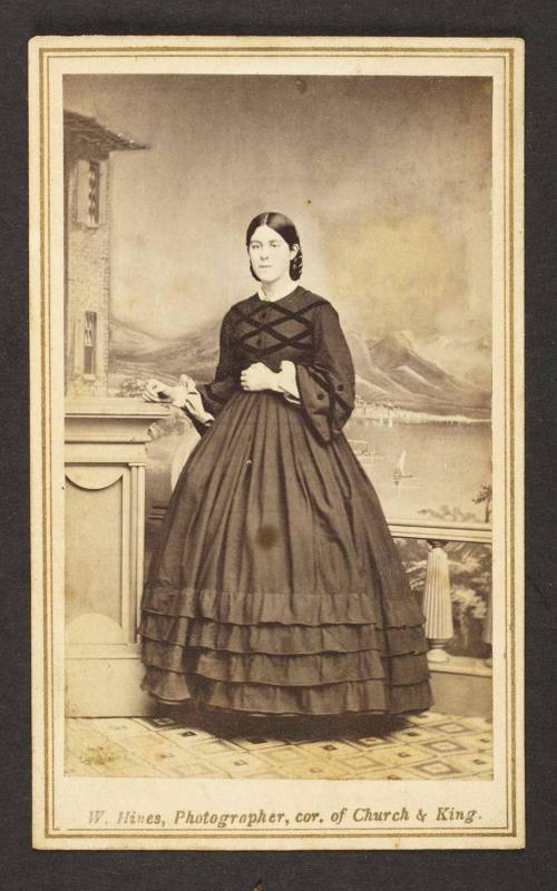 Unknown sitter [portrait of a standing woman with her right hand on pedestal]