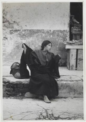 San Cristobel, Mexico [Woman sitting on street]