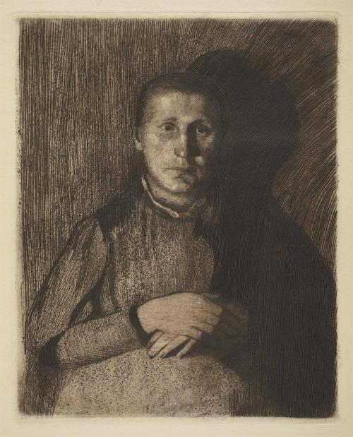 Frau mit übereinandergelegten Händen