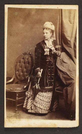 Unknown sitter [portrait of a standing woman with an umbrella]