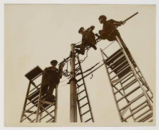 Modern Aladdins, erecting lamp standards, London