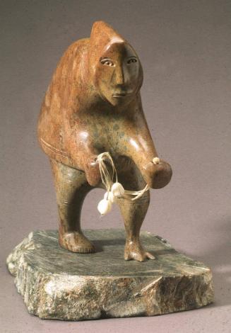 Shaman Holding Bolas